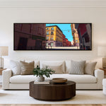 Sunlit City Stories Panoramic Wall Art shown in a living room