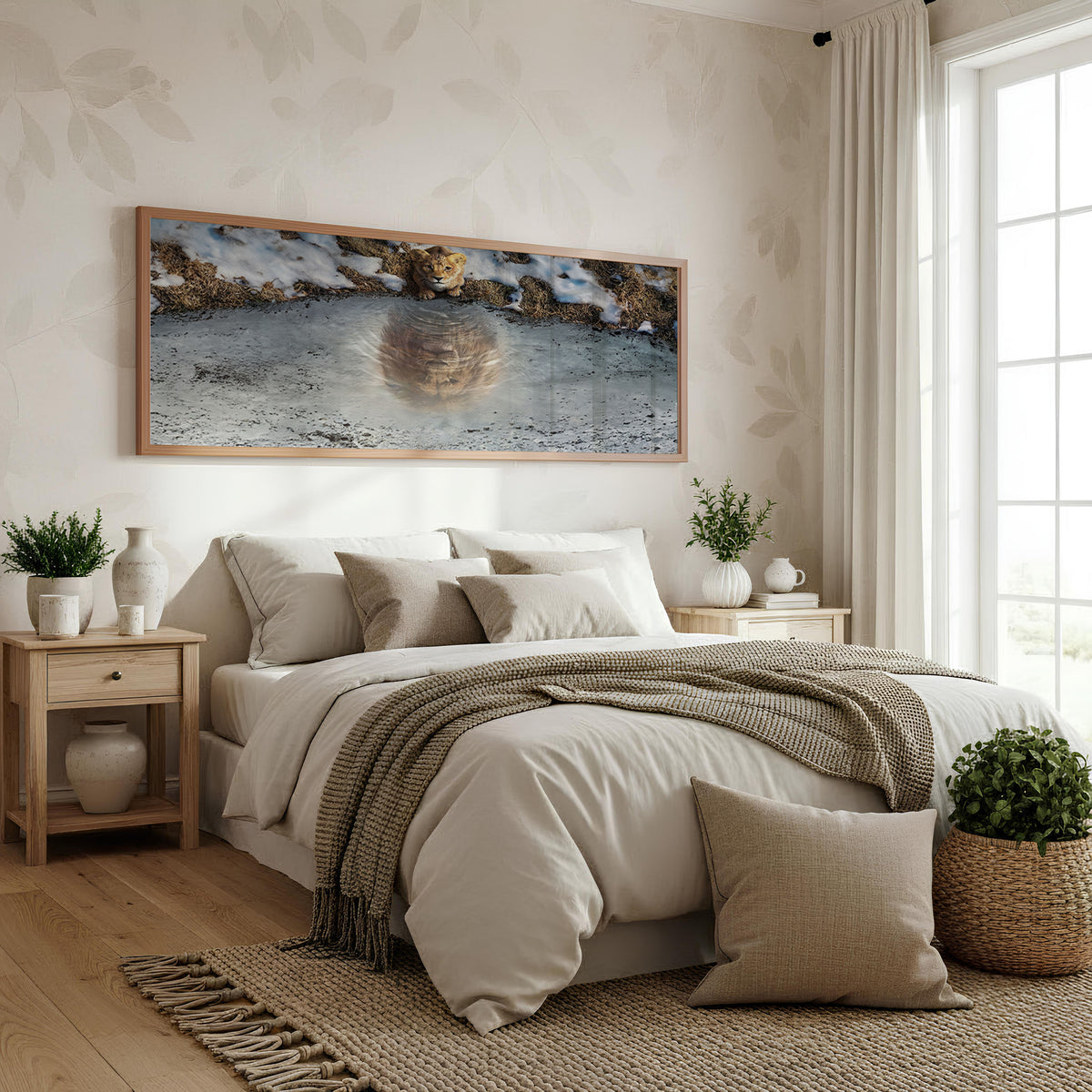 Lion at the Waterhole Panoramic Wall Art shown in a bedroom